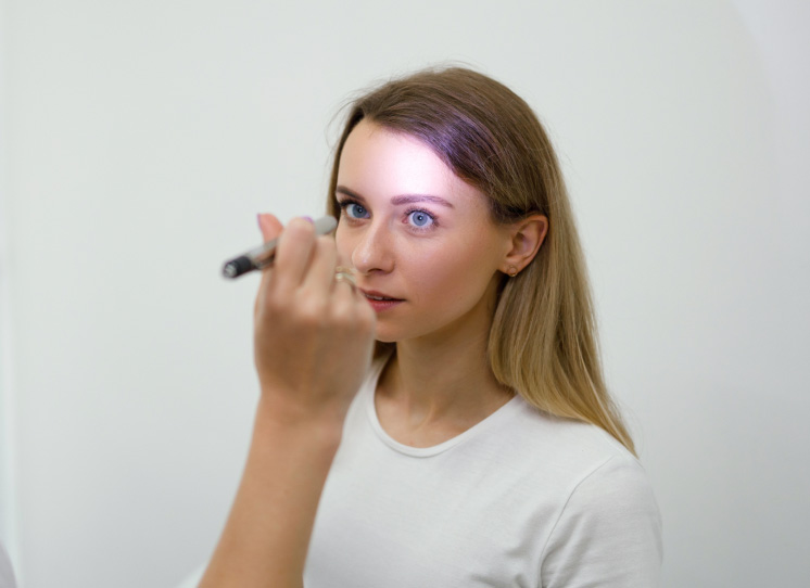 Woman getting an eye exam for dry eye treatment